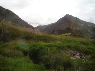Mountain with green valley and cloudy sky