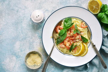 Spaghetti with shrimps in a cream sauce.Top view with copy space.