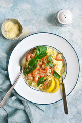 Spaghetti with shrimps in a cream sauce.Top view with copy space.
