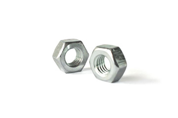 Closeup of nuts isolated on white. Self Drilling screws. Isolated fasteners. Connecting material on white background