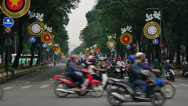  Streets of Vietnam, Ho Chi Minh City, Hanoi, Lots of traffic, people riding on bikes and cars and scooter