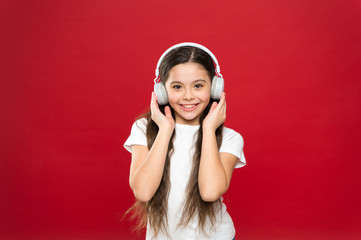 Music taste. Music plays an important part lives teenagers. Powerful effect music teenagers their emotions, perception of world. Girl listen music headphones on red background. Play list concept