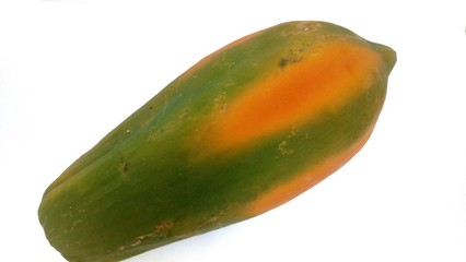 Big green papaya on a white background.