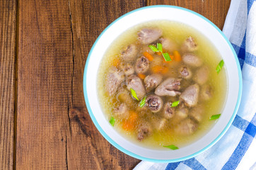 Transparent broth with chicken liver