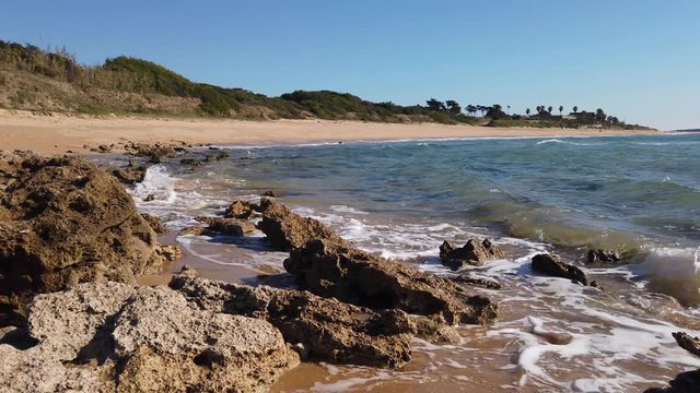 Outflow on the Zahora Beach. Costa de Luz, Cadiz, Spain - slow motion 4k footage