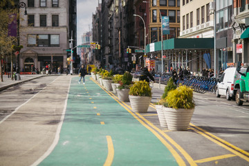 New York City Manhattan Union Square street with bicycle lanes at daytime. - Powered by Adobe