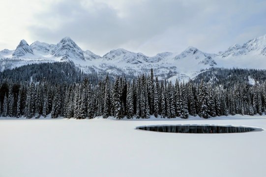 Incredible snowy views from Island Lake in Fernie, British Columbia, Canada.  The majestic winter background is an absolutely beautiful place to go hiking or snowshoeing with fresh fallen snow.