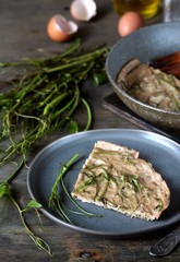 omelet with smilax (sarsaparilla) young shoots in the spring for nutrition. useful food from nature. young shoots are harvested in spring and eaten as asparagus. concept of nutrition from nature.