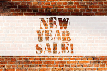 Handwriting text writing New Year Sale. Concept meaning Final holiday season discounts price reductions Offers Brick Wall art like Graffiti motivational call written on the wall