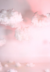 Artificial Cloud float in sky hang with sling over white background, studio lighting with color gel