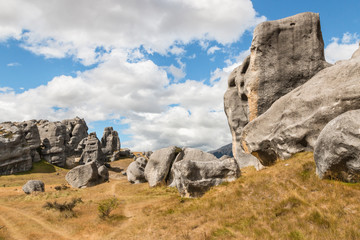 eroded limestone boulders at Castle Hill, New Zealand with sky and copy space