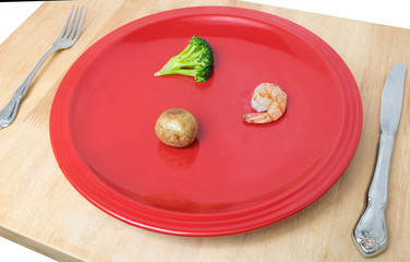 Little food on a big red plate