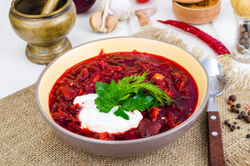 Delicious hot vegetable soup with beetroot, Russian borscht