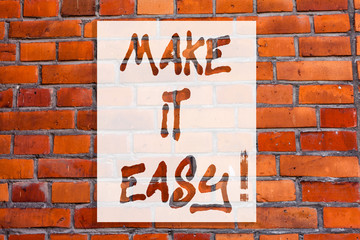 Obraz premium Handwriting text writing Make It Easy. Concept meaning Smart approach Effortless Free from worries or difficulties Brick Wall art like Graffiti motivational call written on the wall