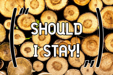 Handwriting text Should I Stay. Concept meaning Looking for reasons to remain on a place Doubtful Indecision Wooden background vintage wood wild message ideas intentions thoughts - obrazy, fototapety, plakaty