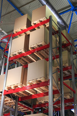 cardboard boxes on pallets and racks in warehouse