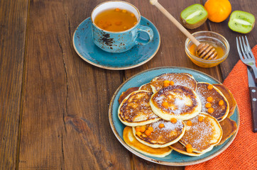 fried pancakes with sugar on plate to Shrovetide
