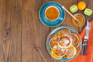 fried pancakes with sugar on plate to Shrovetide