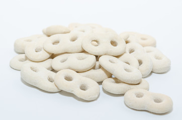 Romanian traditional food called mucenici. Eight shape made from flour, cooked and served with sugar, walnuts and cinnamon