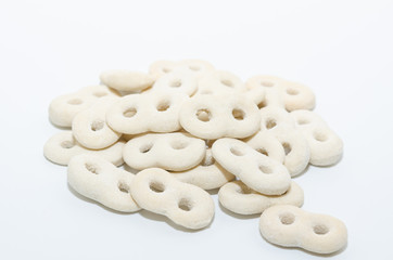 Romanian traditional food called mucenici. Eight shape made from flour, cooked and served with sugar, walnuts and cinnamon