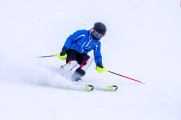Fototapeta na wymiar People are enjoying downhill skiing and snowboarding 