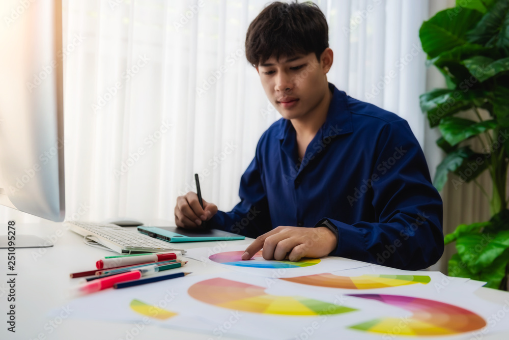 Poster graphic designer man creative using color swatch samples for website layout and application for mobi