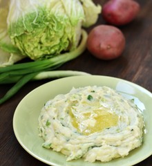 Colcannon Irish Mashed Potatoes St Patrick day food. puree with green onions and butter. copy space. top view