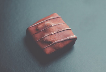 Square Chocolate on black background - gourmet bonbon