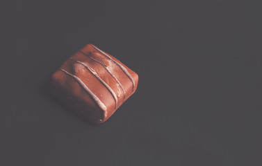 Square Chocolate on black background - gourmet bonbon