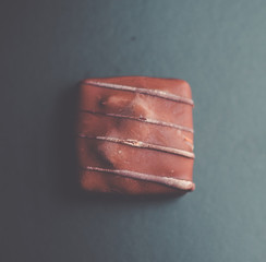 Square Chocolate on black background - gourmet bonbon