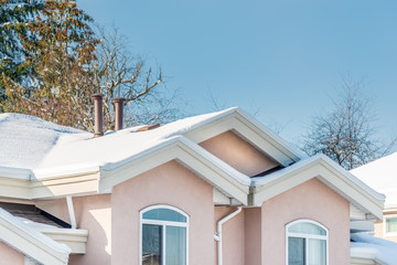 A perfect neighbourhood. Houses in suburb at Winter in the north America. Luxury houses covered nice snow. 