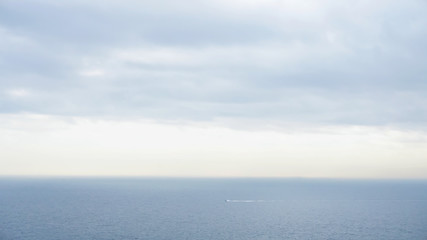 Calm ocean on a cloudy day in Seto Inland Sea, Japan. 