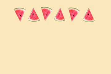 Slices of sweet fruit watermelon isolated on yellow background , Pastel color .