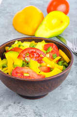 Avocado, sweet paprika, tomatoes, diet salad.