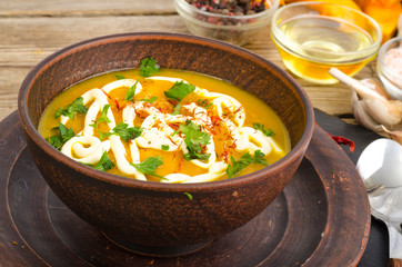 Vegetable puree, vegetarian soup with sour cream and greens.