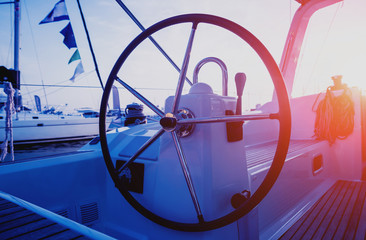 A modern speed boat yacht steering wheels.