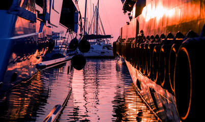 View of harbor with yachts details. Beautiful sunset sky in the marina bay.