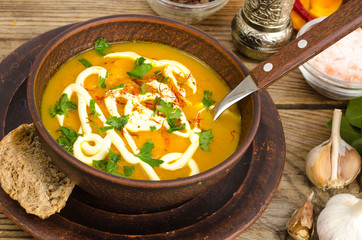 Vegetable puree, vegetarian soup with sour cream and greens.