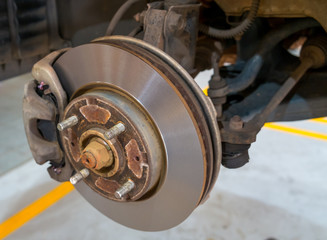 Disc brake of the car during the maintenance at auto service