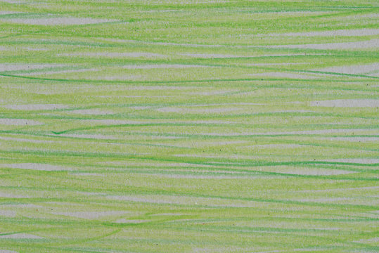 green crayon drawing on gray paper background