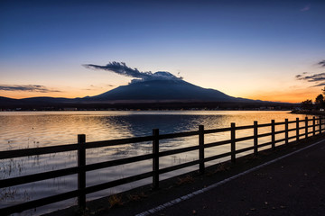 Fuji mountain at Lake Yamanaka at beautiful sunset, Yamanashi, Japan, Mount Fuji or Fujisan located on Honshu Island, is the highest mountain in Japan.