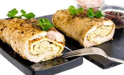 Chicken meat rolls with egg pancakes and carrots.