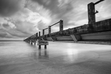Boardwalk on beach at sunrise . Awana Kijal, Kemaman. Malaysia. 