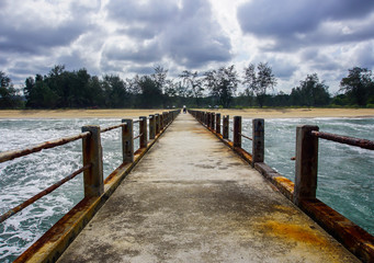Naklejka premium Boardwalk on beach at sunrise . Awana Kijal, Kemaman. Malaysia. 