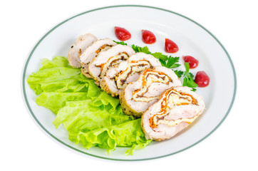 Plate of lettuce and slices of chicken roll.