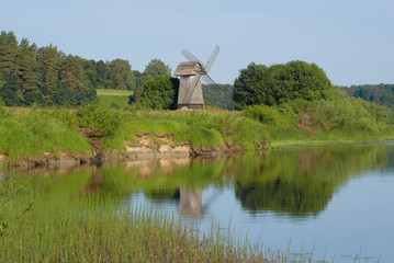 Old windmill on the bank of the river Sorot on the morning of June. Mikhailovskoe, Pushkin Mountains
