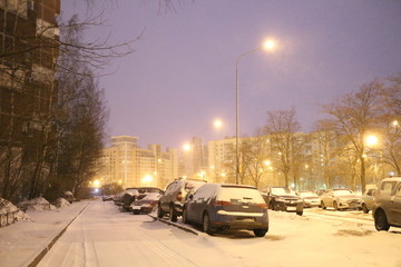 Snow covered roads in the city block at night