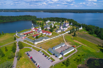 Fototapeta na wymiar View of the Valdaisky Iversky Svyatoozersky Bogoroditsky Monastery on a sunny June day (shooting from a quadrocopter). Novgorod region, Russia