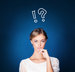 Pretty girl thinking with question mark on blue background. Choice, problem and solution concept