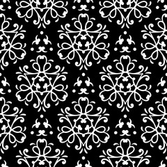 Abstract geometric seamless background. White pattern on black backdrop